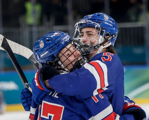 United States Britta Curl (17) celebrates here goal with United States Megan Keller (5) in the second period of the Women s Playoff Quarterfinal game between Italy and the USA at the Milano Rho Ice hockey, Eishockey Arena in Milan, Italy, on Friday, February 13, 2026.  OLY202602138623 AARONxJOSEFCZYK