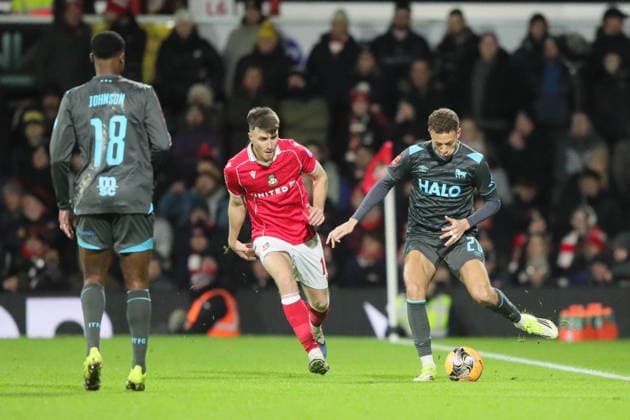 Wrexham FC v Ipswich Town, FA Cup Kasey McAteer of Ipswich Town and George Thomason of Wrexham during the FA Cup match between Wrexham FC and Ipswich Town at the Racecourse Ground, Wrexham, UK on 13 February 2026. Wrexham Racecourse Ground Wales UK Editorial use only DataCo restrictions apply See www.football-dataco.com , Copyright: xAlunxRobertsx PSI-23749-0061