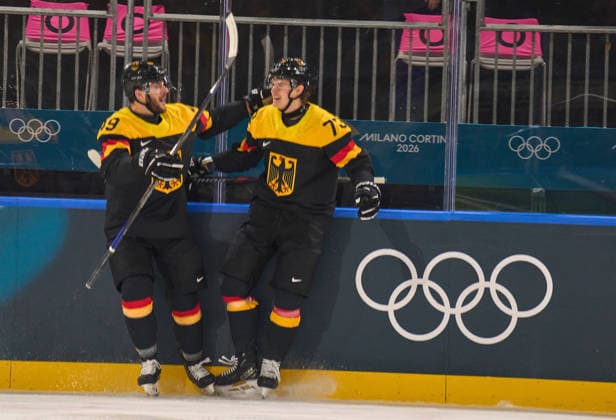 Lukas Reichel of Germany scores for 1-0 at the preliminary men Ice hockey, Eishockey match Group C Germany - Latvia of the Milano Cortina 2026 Winter Olympic Games, Olympische Spiele, Olympia, OS at Milano Rho Ice Hockey Arena on February 14, 2026 in Milan, Italy.
