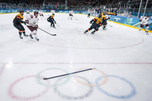 (260214) -- MILAN, Feb. 14, 2026 -- Players of both teams compete during the Ice hockey, Eishockey men s preliminary round group C match between Germany and Latvia of the Milan-Cortina 2026 Olympic Winter games, Winterspiele,Spiele, Summer games in Milan, Italy, Feb. 14, 2026. ) (MICO2026)ITALY-MILAN-OLYMPIC WINTER GAMES-ICE HOCKEY-MEN-PRELIMINARY-GER VS LAT SunxFei 