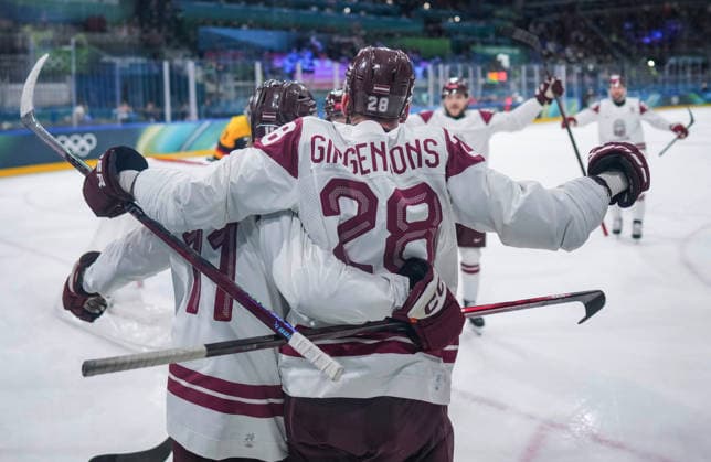 (260214) -- MILAN, Feb. 14, 2026 -- Zegmus Girgensons (R) and Dans Locmelis of Latvia celebrate scoring during the Ice hockey, Eishockey men s preliminary round group C match between Germany and Latvia of the Milan-Cortina 2026 Olympic Winter games, Winterspiele,Spiele, Summer games in Milan, Italy, Feb. 14, 2026. ) (MICO2026)ITALY-MILAN-OLYMPIC WINTER GAMES-ICE HOCKEY-MEN-PRELIMINARY-GER VS LAT SunxFei 