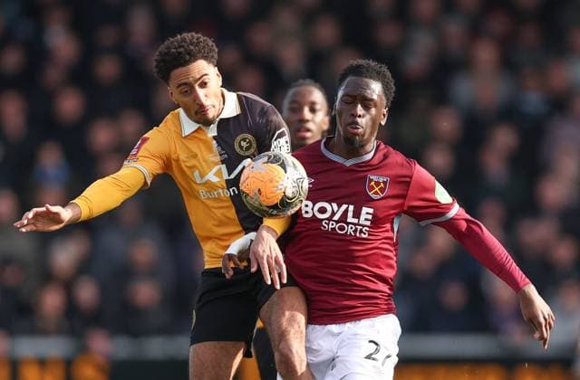 Kain Adom of Burton Albion and Soungoutou Magassa of West Ham United Burton Albion v West Ham United, Emirates FA Cup, Fourth Round, Football, Pirelli Stadium, Burton upon Trent, UK - 14 Feb 2026Burton upon Trent Pirelli Stadium United Kingdom EDITORIAL USE ONLY No use with unauthorised audio, video, data, fixture lists, club league logos or live services. Online in-match use limited to 120 images, no video emulation. No use in betting, games or single club league player publications. Copyright: xRyanxBrowne Shutterstockx 16608141as