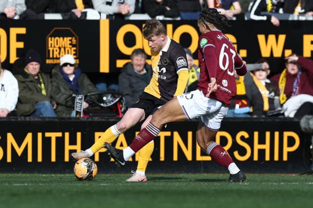 Burton Albion v West Ham United, FA Cup Burton Albion midfielder Andy Cannon (on loan from Wrexham) (42) gets a cross over past West Ham United defender Ezra Mayers (63) during the FA Cup match between Burton Albion and West Ham United at the Pirelli Stadium, Burton upon Trent, UK on 14 February 2026. Burton upon Trent Pirelli Stadium Staffordshire UK Editorial use only DataCo restrictions apply See www.football-dataco.com , Copyright: xJohnxMallettx PSI-23741-0092