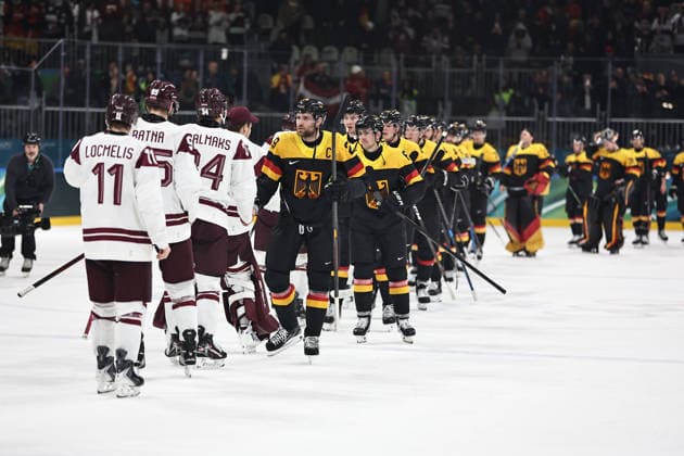 German team congratulates Latvia after preliminaries (GER-LAT) at 2026 Ice hockey, Eishockey Olympic Games, Olympische Spiele, Olympia, OS in Milan; 14 02 2026 - *** German team congratulates Latvia after preliminaries GER LAT at 2026 ice hockey olympic games in Milan 14 02 2026 