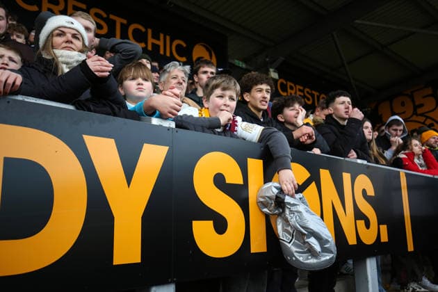 Burton v West Ham 14 February 2026, Burton - Emirates FA Cup, Fourth Round - Burton Albion v West Ham United - A partially deflated trophy, held by a Burton fan as the end of extra time approaches - Photo: Charlotte Wilson Offside. Burton UK Copyright: xCharlottexWilsonx xOffsidexOffside