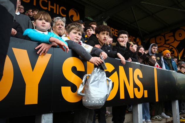 Burton v West Ham 14 February 2026, Burton - Emirates FA Cup, Fourth Round - Burton Albion v West Ham United - A partially deflated trophy, held by a Burton fan as the end of extra time approaches - Photo: Charlotte Wilson Offside. Burton UK Copyright: xCharlottexWilsonx xOffsidexOffside