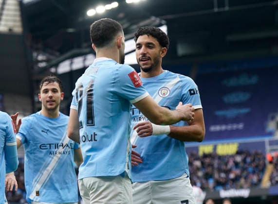 Manchester, England, 14th February 2026. Rayan Alt-Nouri of Manchester City and Omar Marmoush of Manchester City celebrate their first goal an own goal during the Manchester City vs Salford City FA Cup fourth round match at the Etihad Stadium, Manchester. Picture credit should read: Andrew Yates Sportimage EDITORIAL USE ONLY. No use with unauthorised audio, video, data, fixture lists, club league logos or live services. Online in-match use limited to 120 images, no video emulation. No use in betting, games or single club league player publications. SPI_021_AY_Man_City_Salford SPI-4533-0023