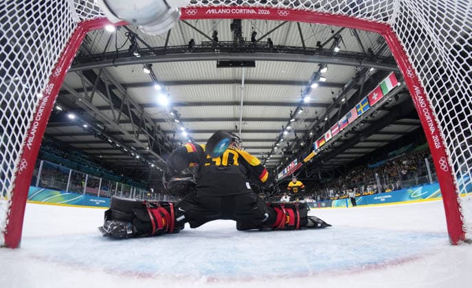 (260214) -- MILAN, Feb. 14, 2026 -- Philipp Grubauer, goalkeeper of Germany fails to make a save during the Ice hockey, Eishockey men s preliminary round group C match between Germany and Latvia of the Milan-Cortina 2026 Olympic Winter games, Winterspiele,Spiele, Summer games in Milan, Italy, Feb. 14, 2026. ( Pool via Xinhua) (MICO2026)ITALY-MILAN-OLYMPIC WINTER GAMES-ICE HOCKEY-MEN-PRELIMINARY-GER VS LAT SunxFei 