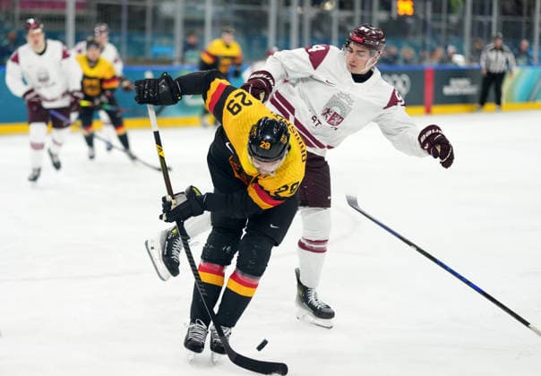 (260214) -- MILAN, Feb. 14, 2026 -- Leon Draisaitl (L) of Germany and Kristians Rubins of Latvia battle for the puck during the Ice hockey, Eishockey men s preliminary round group C match between Germany and Latvia of the Milan-Cortina 2026 Olympic Winter games, Winterspiele,Spiele, Summer games in Milan, Italy, Feb. 14, 2026. ) (MICO2026)ITALY-MILAN-OLYMPIC WINTER GAMES-ICE HOCKEY-MEN-PRELIMINARY-GER VS LAT SunxFei 