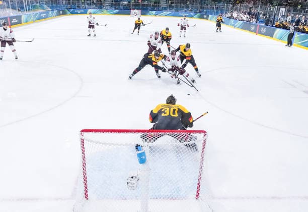 (260214) -- MILAN, Feb. 14, 2026 -- Sandis Vilmanis (C, 2nd R) of Latvia breaks through during the Ice hockey, Eishockey men s preliminary round group C match between Germany and Latvia of the Milan-Cortina 2026 Olympic Winter games, Winterspiele,Spiele, Summer games in Milan, Italy, Feb. 14, 2026. ) (MICO2026)ITALY-MILAN-OLYMPIC WINTER GAMES-ICE HOCKEY-MEN-PRELIMINARY-GER VS LAT SunxFei 