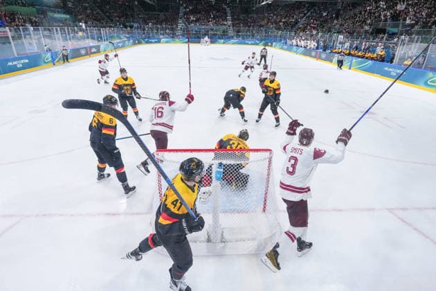 (260214) -- MILAN, Feb. 14, 2026 -- Players of Latvia celebrate a goal during the Ice hockey, Eishockey men s preliminary round group C match between Germany and Latvia of the Milan-Cortina 2026 Olympic Winter games, Winterspiele,Spiele, Summer games in Milan, Italy, Feb. 14, 2026. ) (MICO2026)ITALY-MILAN-OLYMPIC WINTER GAMES-ICE HOCKEY-MEN-PRELIMINARY-GER VS LAT SunxFei 