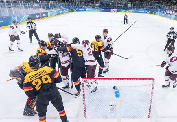 (260214) -- MILAN, Feb. 14, 2026 -- Players of both teams fight during the Ice hockey, Eishockey men s preliminary round group C match between Germany and Latvia of the Milan-Cortina 2026 Olympic Winter games, Winterspiele,Spiele, Summer games in Milan, Italy, Feb. 14, 2026. ) (MICO2026)ITALY-MILAN-OLYMPIC WINTER GAMES-ICE HOCKEY-MEN-PRELIMINARY-GER VS LAT SunxFei 
