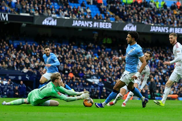Manchester City v Salford City, FA Cup Matthew Young (1) of Salford City saves at the feet of Omar Marmoush (7) of Manchester City during the FA Cup match between Manchester City and Salford City at the Etihad Stadium, Manchester, UK on 14 February 2026. Manchester Etihad Stadium Manchester UK Editorial use only DataCo restrictions apply See www.football-dataco.com , Copyright: xConorxMolloyx PSI-23752-0033