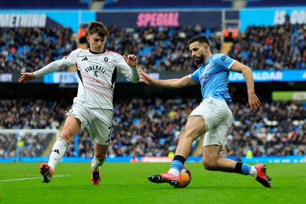Manchester City v Salford City, FA Cup Rayan Ait-Nouri (21) of Manchester City is challenged by Ben Woodburn (7) of Salford City during the FA Cup match between Manchester City and Salford City at the Etihad Stadium, Manchester, UK on 14 February 2026. Manchester Etihad Stadium Manchester UK Editorial use only DataCo restrictions apply See www.football-dataco.com , Copyright: xConorxMolloyx PSI-23752-0035