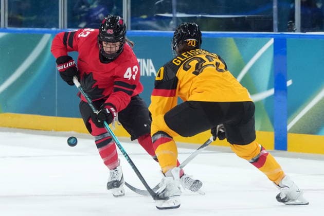 February 14, 2026, Milan, ITALY: Canada s Kristin O Neill (43) and Germany s Daria Gleissner (20) vie for control of the puck during the first period of a women s hockey quarterfinal game at the 2026 Winter Olympics, in Milan, Saturday, Feb. 14, 2026. Canada News - February 14, 2026  - ZUMAc35_ 20260214_zaf_c35_017 Copyright: xDarrylxDyckx