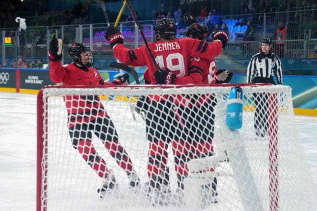 February 14, 2026, Milan, ITALY: Canada s Brianne Jenner (19) celebrates her goal with teammates during the first period of a women s hockey quarterfinal game against Germany at the 2026 Winter Olympics, in Milan, Saturday, Feb. 14, 2026. Canada News - February 14, 2026  - ZUMAc35_ 20260214_zaf_c35_012 Copyright: xDarrylxDyckx