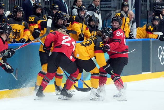 February 14, 2026, Milan, ITALY: Canada s Jennifer Gardiner (94) checks Germany s Lilli Welcke (23) during the first period of a women s hockey quarterfinal game at the 2026 Winter Olympics, in Milan, Saturday, Feb. 14, 2026. Canada News - February 14, 2026  - ZUMAc35_ 20260214_zaf_c35_019 Copyright: xDarrylxDyckx