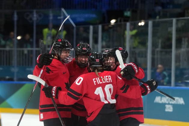 February 14, 2026, Milan, ITALY: Canada s Claire Thompson (42) celebrates her goal with teammates Sophie Jaques (2), Sarah Fillier (10), Kristin O Neill (43) and Daryl Watts (95) during the first period of a women s hockey quarterfinal game against Germany at the 2026 Winter Olympics, in Milan, Saturday, Feb. 14, 2026. Canada News - February 14, 2026  - ZUMAc35_ 20260214_zaf_c35_023 Copyright: xDarrylxDyckx
