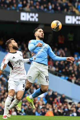 14th February 2026; Etihad Stadium, Manchester, Lancashire, England; FA Cup Football, Manchester City versus Salford City ; Rayan Cherki of Manchester City controls the ball under pressure from Jorge Grant of Salford City  DavidxBlunsden Content restricted for UK based newspaper