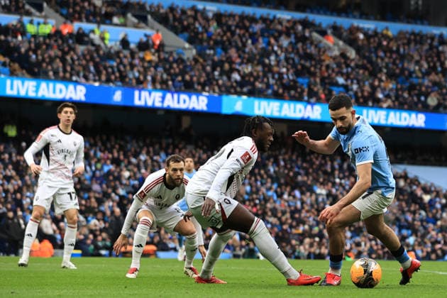 14th February 2026; Etihad Stadium, Manchester, Lancashire, England; FA Cup Football, Manchester City versus Salford City ; Rayan Ait-Nouri of Manchester City takes on Rosaire Longelo of Salford City  DavidxBlunsden Content restricted for UK based newspaper