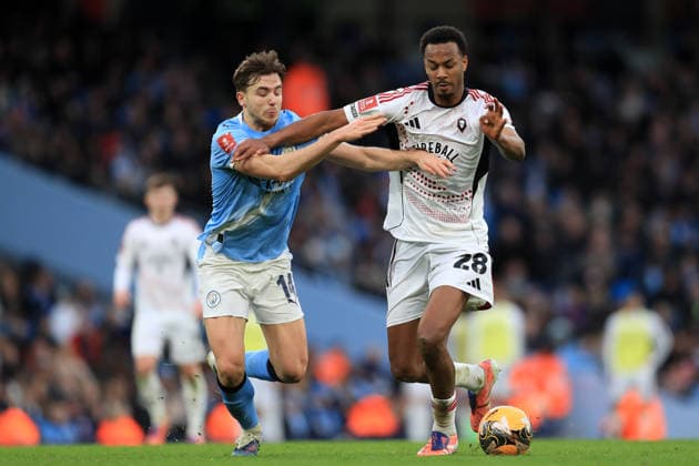 14th February 2026; Etihad Stadium, Manchester, Lancashire, England; FA Cup Football, Manchester City versus Salford City ; Nico Gonzales of Manchester City tackles Zach Awe of Salford City  DavidxBlunsden Content restricted for UK based newspaper