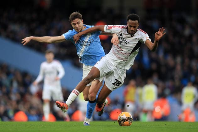 14th February 2026; Etihad Stadium, Manchester, Lancashire, England; FA Cup Football, Manchester City versus Salford City ; Nico Gonzales of Manchester City tackles Zach Awe of Salford City  DavidxBlunsden Content restricted for UK based newspaper