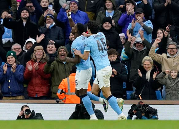 Manchester, England, 14th February 2026. Marc Guehi of Manchester City celebrates scoring the second goal during the Manchester City vs Salford City FA Cup fourth round match at the Etihad Stadium, Manchester. Picture credit should read: Andrew Yates Sportimage EDITORIAL USE ONLY. No use with unauthorised audio, video, data, fixture lists, club league logos or live services. Online in-match use limited to 120 images, no video emulation. No use in betting, games or single club league player publications. SPI_054_AY_Man_City_Salford SPI-4533-0056