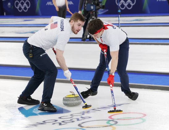 USA s Aidan Oldenburg and Ben Richardson polish the ice in their match against Germany in the Round Robin Team Curling match at the 2026 Winter Olympics in Cortina, Italy on Saturday February 14, 2026. USA won the match 8-6.  OLY20260214613 HUGOxPHILPOTT