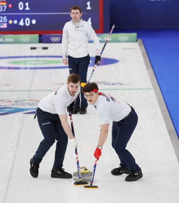 USA s Aidan Oldenburg and Ben Richardson polish the ice in their match against Germany in the Round Robin Team Curling match at the 2026 Winter Olympics in Cortina, Italy on Saturday February 14, 2026. USA won the match 8-6.  OLY20260214620 HUGOxPHILPOTT