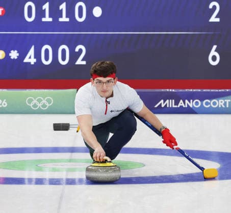 USA s Aidan Oldenburg releases the stone in the match against Germany in the Round Robin Team Curling match at the 2026 Winter Olympics in Cortina, Italy on Saturday February 14, 2026. USA won the match 8-6.  OLY20260214623 HUGOxPHILPOTT