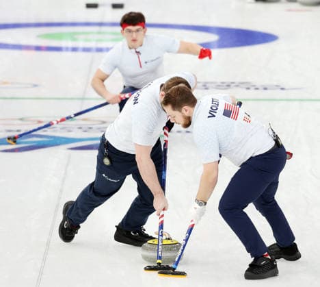 USA s Aidan Oldenburg releases the stone in the match against Germany in the Round Robin Team Curling match at the 2026 Winter Olympics in Cortina, Italy on Saturday February 14, 2026. USA won the match 8-6.  OLY20260214626 HUGOxPHILPOTT