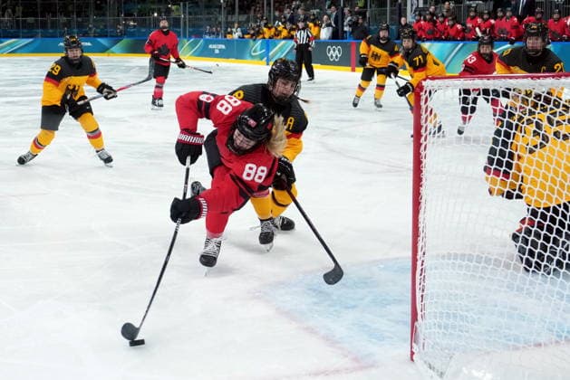 February 14, 2026, Milan, ITALY: Canada s Julia Gosling (88) gets checked by Germany s Ronja Hark (8) during the second period of a women s hockey quarterfinal game at the 2026 Winter Olympics, in Milan, Saturday, Feb. 14, 2026. Canada News - February 14, 2026  - ZUMAc35_ 20260214_zaf_c35_029 Copyright: xDarrylxDyckx