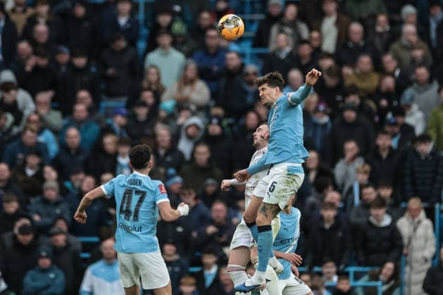 Emirates FA Cup 4th Round Manchester City v Salford City John Stones of Manchester City jumps up to win the high ball during the Emirates FA Cup 4th Round match Manchester City vs Salford City at Etihad Stadium, Manchester, United Kingdom on 14 February 2026 (Photo by Mark Cosgrove News Images) Manchester Etihad Stadium Greater Manchester United, ManU Kingdom Copyright: xMarkxCosgrove NewsxImagesx