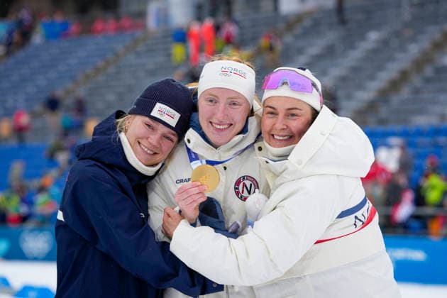 Winter Olympics in Milan Cortina 2026 Anterselva, Italy 20260214. Juni Arnekleiv and Ingrid Tandrevold hug gold medalist Maren Kirkeeide after the 7.5 km sprint women s biathlon during the Winter Olympics in Milan Cortina 2026. Photo: Heiko Junge NTB Anterselva Italy EDITORIAL USE ONLY. RESTRICTED USE FOR BETTING COMPANIES Ref:_SPOTa-jQQLaPyg.jpg *** Winter Olympics in Milan Cortina 2026 Anterselva, Italy 20260214 Juni Arnekleiv and Ingrid Tandrevold hug gold medalist Maren Kirkeeide after the 7 5 km sprint women s biathlon during the Winter Olympics in Milan Cortina 2026 Photo Heiko Junge NTB Anterselva Italy EDITORIAL USE ONLY RESTRICTED USE FOR BETTING COMPANIES  Copyright: xHeikoxJungex xNTBx