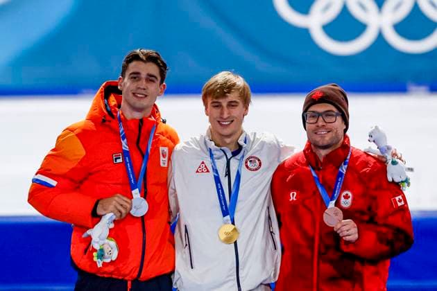 second Jenning de Boo of the Netherlands and winner Jordan Stolz of United States of America and third Laurent Dubreuil of Canada smiling during the medal ceremony after Men s 500m, Milano Cortina 2026 Winter Olympics: Day 8, Speed skating, Eisschnelllauf - Milano Cortina 2026 Winter Olympics: Day 8, Milano Speed Skating Stadium, February 14, 2026, Milan, Italy.