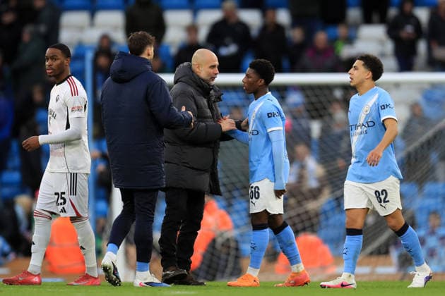 14th February 2026; Etihad Stadium, Manchester, Lancashire, England; FA Cup Football, Manchester City versus Salford City ; Manchester City manager Pep Guardiola shakes hands with Ryan McAidoo at full time  DavidxBlunsden Content restricted for UK based newspaper