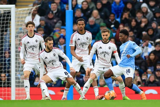 Manchester City v Salford City, FA Cup Ryan McAidoo (56) of Manchester City is surrounded by Salford players during the FA Cup match between Manchester City and Salford City at the Etihad Stadium, Manchester, UK on 14 February 2026. Manchester Etihad Stadium Manchester UK Editorial use only DataCo restrictions apply See www.football-dataco.com , Copyright: xConorxMolloyx PSI-23752-0071