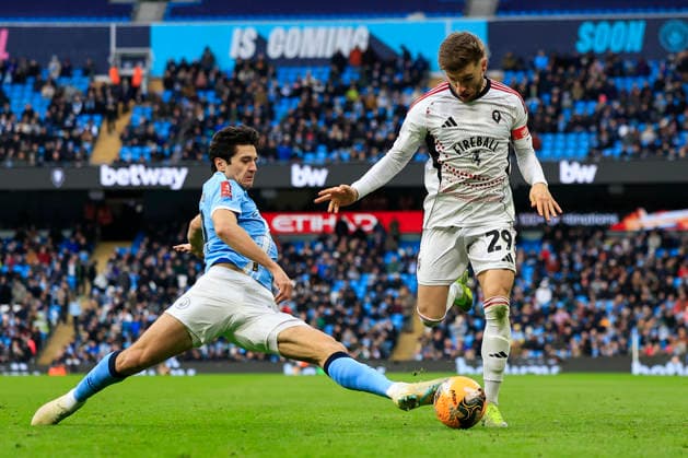 Manchester City v Salford City, FA Cup Luke Garbutt (29) of Salford City is challenged by Abdukodir Khusanov (45) of Manchester City during the FA Cup match between Manchester City and Salford City at the Etihad Stadium, Manchester, UK on 14 February 2026. Manchester Etihad Stadium Manchester UK Editorial use only DataCo restrictions apply See www.football-dataco.com , Copyright: xConorxMolloyx PSI-23752-0077