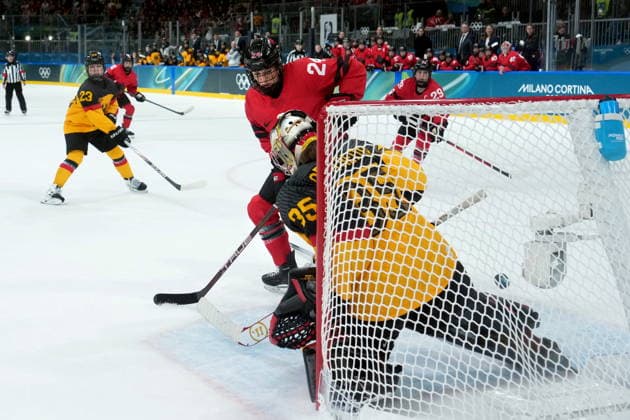 February 14, 2026, Milan, ITALY: Canada s Natalie Spooner (24) watches the puck go in from a shot by teammate Sarah Fillier as Germany goalie Sandra Abstreiter misses the stop during the second period of a women s hockey quarterfinal game at the 2026 Winter Olympics, in Milan, Saturday, Feb. 14, 2026. Canada News - February 14, 2026  - ZUMAc35_ 20260214_zaf_c35_063 Copyright: xDarrylxDyckx