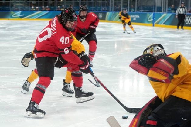 February 14, 2026, Milan, ITALY: Canada s Blayre Turnbull (40) scores on Germany goalie Sandra Abstreiter (35) during the third period of a women s hockey quarterfinal game at the 2026 Winter Olympics, in Milan, Saturday, Feb. 14, 2026. Canada News - February 14, 2026  - ZUMAc35_ 20260214_zaf_c35_064 Copyright: xDarrylxDyckx