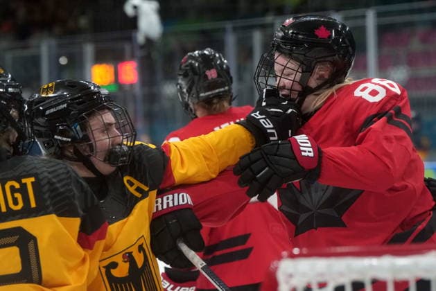February 14, 2026, Milan, ITALY: Germany s Ronja Hark (8) shoves Canada s Julia Gosling (88) during the third period of a women s hockey quarterfinal game at the 2026 Winter Olympics, in Milan, Saturday, Feb. 14, 2026. Canada News - February 14, 2026  - ZUMAc35_ 20260214_zaf_c35_070 Copyright: xDarrylxDyckx