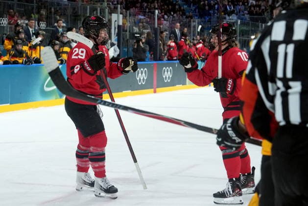 February 14, 2026, Milan, ITALY: Canada s Marie-Philip Poulin (29) celebrates her goal with teammate Sarah Fillier (10) during the third period of a women s hockey quarterfinal game against Germany at the 2026 Winter Olympics, in Milan, Saturday, Feb. 14, 2026. Canada News - February 14, 2026  - ZUMAc35_ 20260214_zaf_c35_073 Copyright: xDarrylxDyckx
