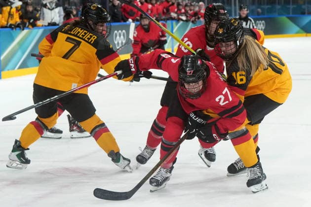February 14, 2026, Milan, ITALY: Germany s Jule Schiefer (16) checks Canada s Emma Maltais (27) during the third period of a women s hockey quarterfinal game at the 2026 Winter Olympics, in Milan, Saturday, Feb. 14, 2026. Canada News - February 14, 2026  - ZUMAc35_ 20260214_zaf_c35_076 Copyright: xDarrylxDyckx