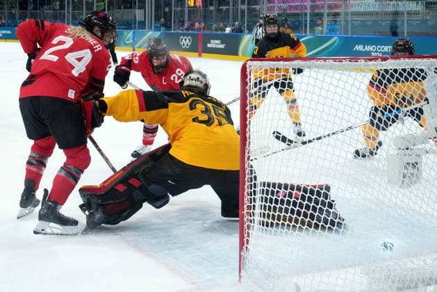 February 14, 2026, Milan, ITALY: Canada s Marie-Philip Poulin (29) scores on Germany goalie Sandra Abstreiter (35) during the third period of a women s hockey quarterfinal game at the 2026 Winter Olympics, in Milan, Saturday, Feb. 14, 2026. Canada News - February 14, 2026  - ZUMAc35_ 20260214_zaf_c35_074 Copyright: xDarrylxDyckx