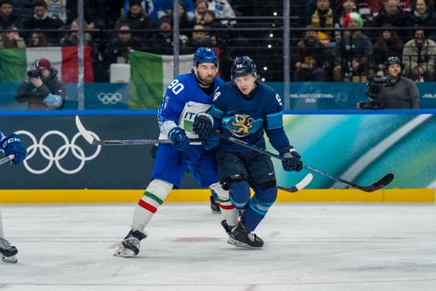 February 14, 2026, Milan, Lombardy, Italy: Defender Dylan Di Perna 90 of Team Italy and Forward Joel Kiviranta 94 of Team Finland fight for the puck during the Team Finland against Team Italy in the Preliminary Round Group B at the Milano Santagiulia Ice hockey, Eishockey Arena in MILAN, Italy during the 2026 Milano Cortina Winter Olympics. Team Finland defeats Team Italy, 11:0. Milan Italy - ZUMAa161 20260214_oly_a161_060 Copyright: xWalterxG.xArcex