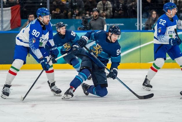 February 14, 2026, Milan, Lombardy, Italy: Defender Dylan Di Perna 90 of Team Italy and Forward Joel Kiviranta 94 of Team Finland fight for the puck during the Team Finland against Team Italy in the Preliminary Round Group B at the Milano Santagiulia Ice hockey, Eishockey Arena in MILAN, Italy during the 2026 Milano Cortina Winter Olympics. Team Finland defeats Team Italy, 11:0. Milan Italy - ZUMAa161 20260214_oly_a161_062 Copyright: xWalterxG.xArcex