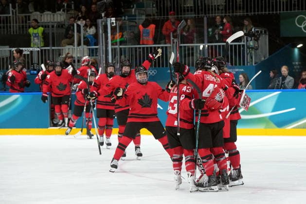 February 14, 2026, Milan, ITALY: Canada players celebrate the team s 5-1 win over Germany following the third period of a women s hockey quarterfinal game at the 2026 Winter Olympics, in Milan, Saturday, Feb. 14, 2026. Canada News - February 14, 2026  - ZUMAc35_ 20260214_zaf_c35_080 Copyright: xDarrylxDyckx