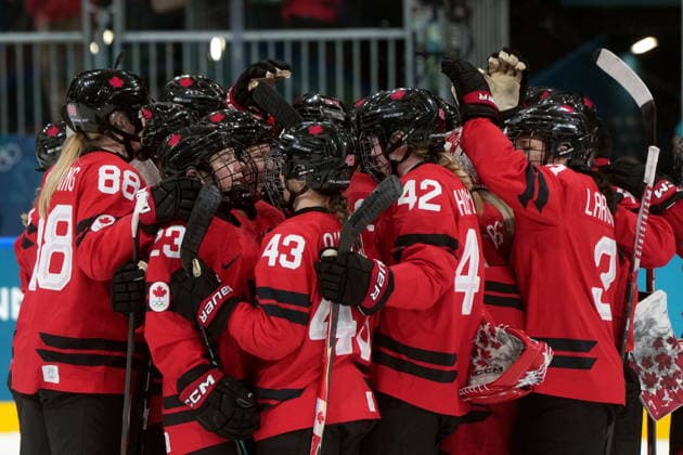 February 14, 2026, Milan, ITALY: Canada players celebrate the team s 5-1 win over Germany following the third period of a women s hockey quarterfinal game at the 2026 Winter Olympics, in Milan, Saturday, Feb. 14, 2026. Canada News - February 14, 2026  - ZUMAc35_ 20260214_zaf_c35_082 Copyright: xDarrylxDyckx