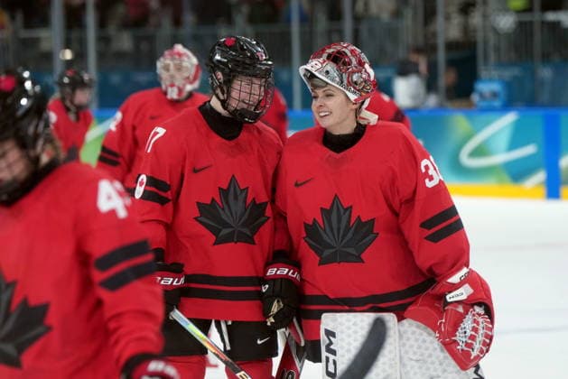 February 14, 2026, Milan, ITALY: Canada s Ella Shelton (17) and teammate Emerance Maschmeyer (38) celebrate the team s 5-1 win over Germany following the third period of a women s hockey quarterfinal game at the 2026 Winter Olympics, in Milan, Saturday, Feb. 14, 2026. Canada News - February 14, 2026  - ZUMAc35_ 20260214_zaf_c35_083 Copyright: xDarrylxDyckx