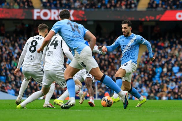 Manchester City v Salford City, FA Cup Rayan Cherki (10) of Manchester City runs into the Salford defence during the FA Cup match between Manchester City and Salford City at the Etihad Stadium, Manchester, UK on 14 February 2026. Manchester Etihad Stadium Manchester UK Editorial use only DataCo restrictions apply See www.football-dataco.com , Copyright: xConorxMolloyx PSI-23752-0106
